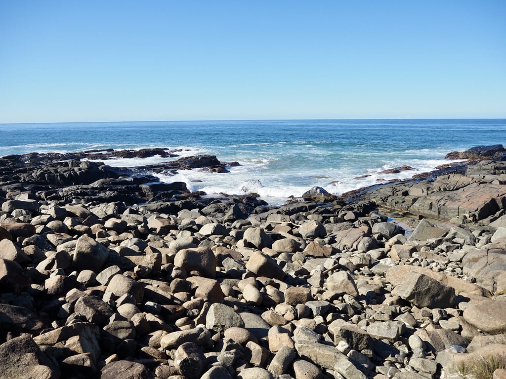 Climbing rocks on the way to Kei River Mouth