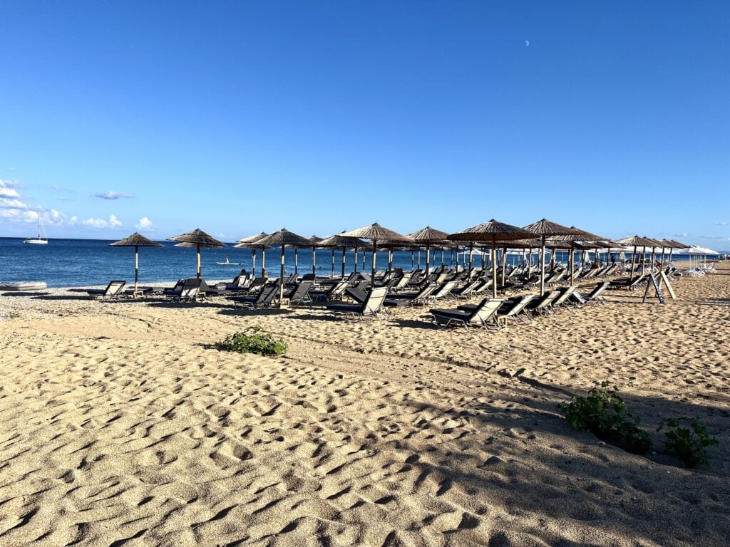 View of Skala beach with beach chairs, Greece